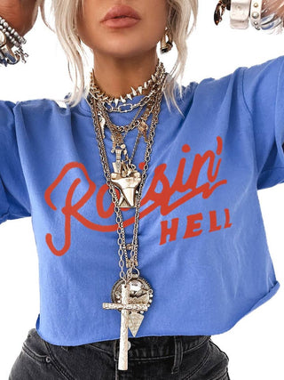 Cobalt blue Raisin' Hell cropped graphic tee by Pebby Forevee